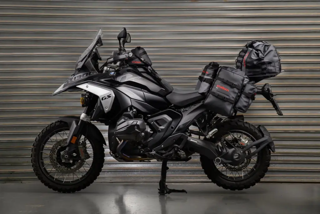 Black BMW R 1300 GS with Turkana Gear soft luggage in a studio