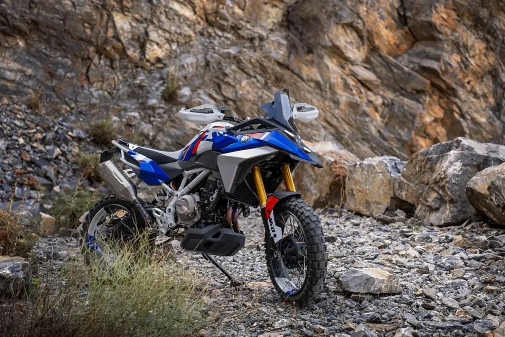 BMW Concept F 450 GS in blue, white and red parked among rocks