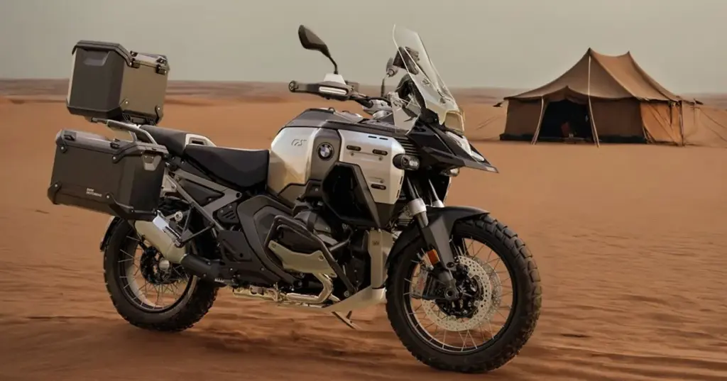 BMW R 1300 GS Adventure Triple Black with panniers parked in the desert beside a tent
