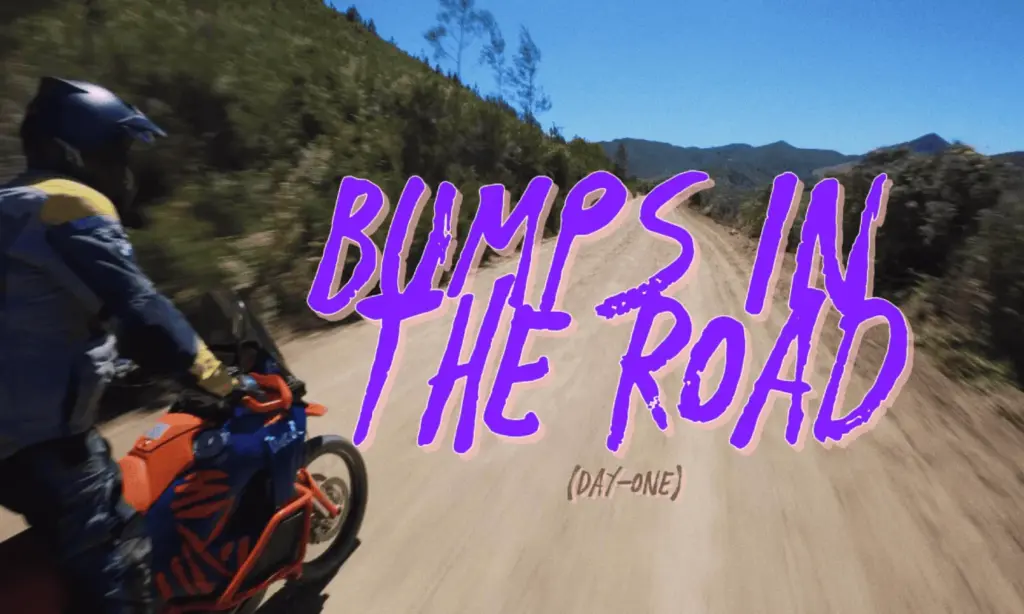 Bumps in the Road father and son adventure title card on a dirt road