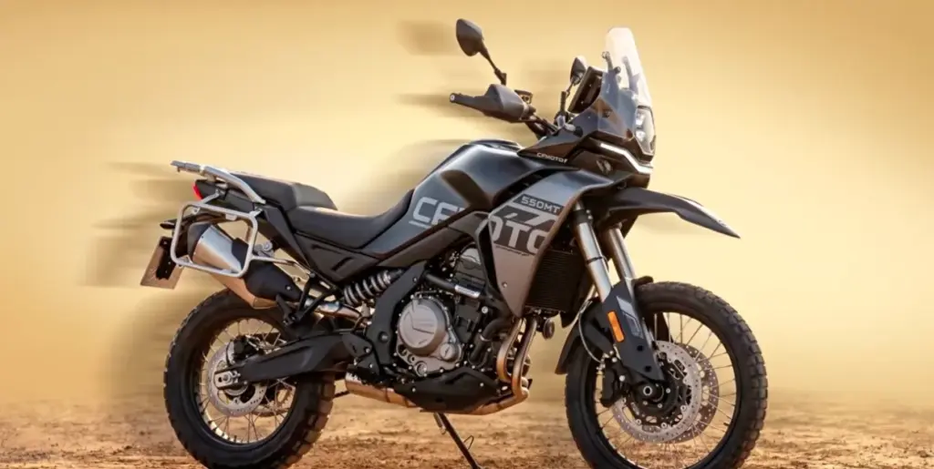 CFMOTO 550MT adventure motorcycle in black and grey, side view against a sandy desert backdrop