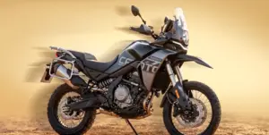 CFMOTO 550MT adventure motorcycle in black and grey, side view against a sandy desert backdrop