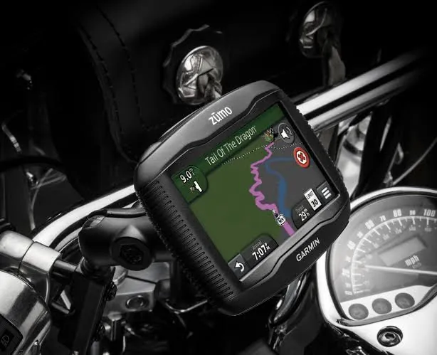 Garmin zumo GPS mounted on motorcycle handlebars showing a route