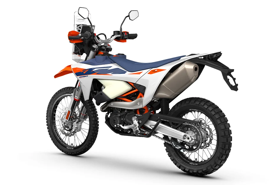 2027 KTM 690 Rally rear three-quarter view, showing the 13-litre rear tank bodywork and silencer