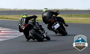 Two riders cornering on track at Red Star Raceway during Triumph SA training
