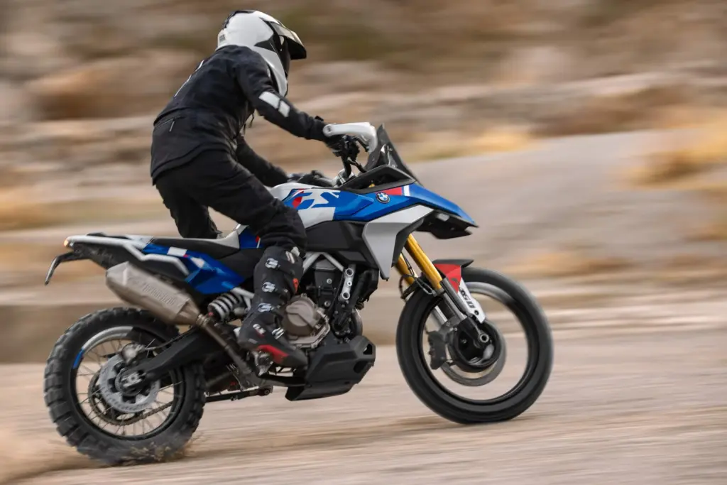 Rider on the BMW Concept F 450 GS on a dirt road