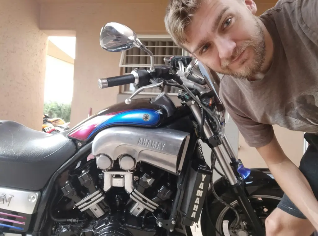 Rider taking a selfie with his black Yamaha V-Max