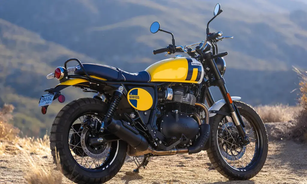 Royal Enfield Bear 650 in yellow and blue on a mountain road