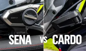 Sena and Cardo motorcycle intercoms mounted on helmets, side by side