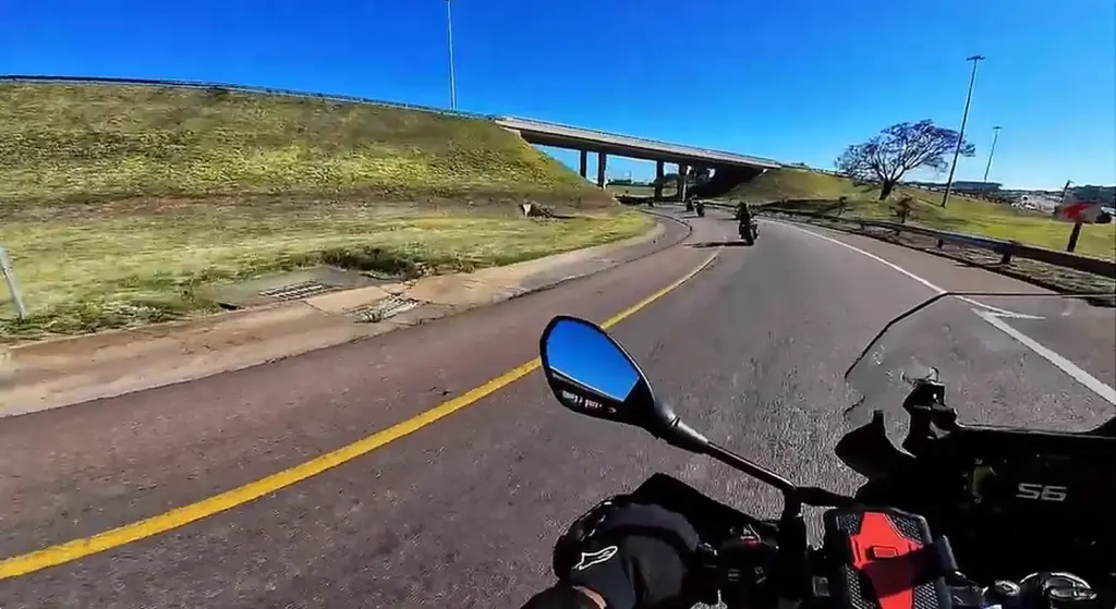 Motorcyclists riding together on a sunny Gauteng road during Synergy Racing Academy's social ride to Harvard Café