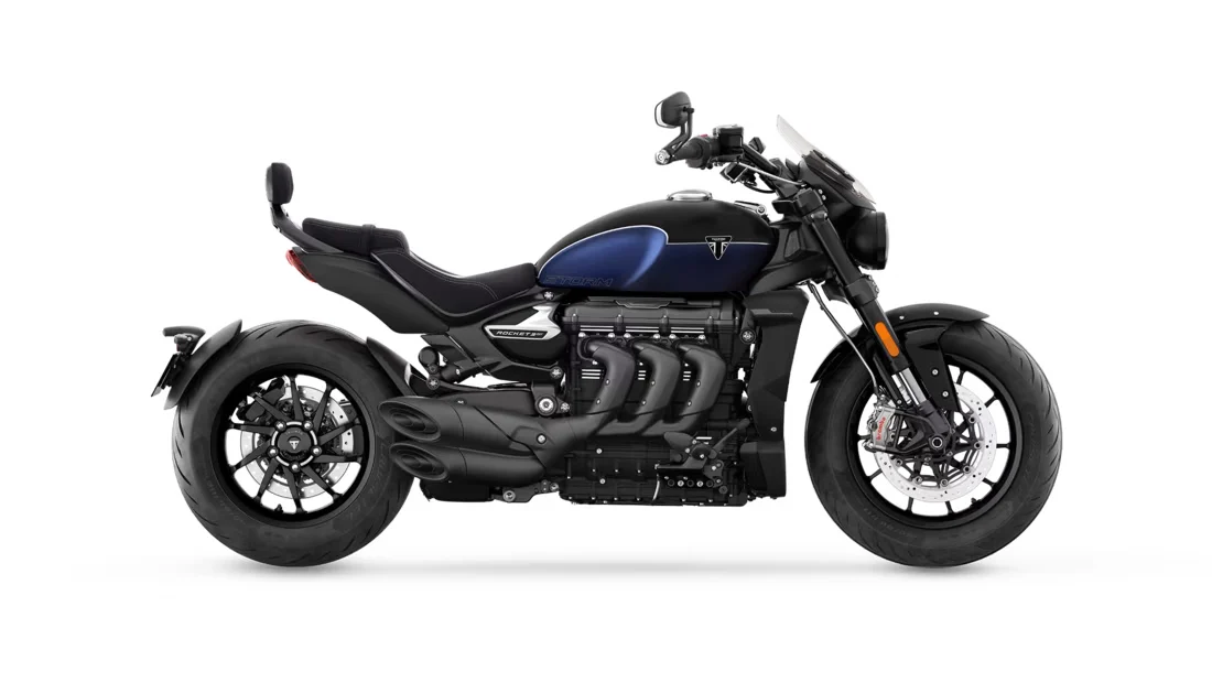 Triumph Rocket 3 Storm GT side view, black with a blue tank, flyscreen and pillion backrest