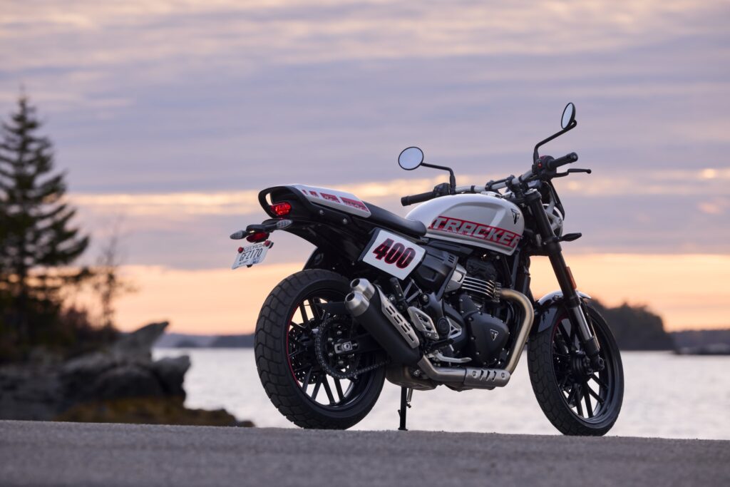 Rear three-quarter view of the Triumph Tracker 400 with its number board and upswept silencer