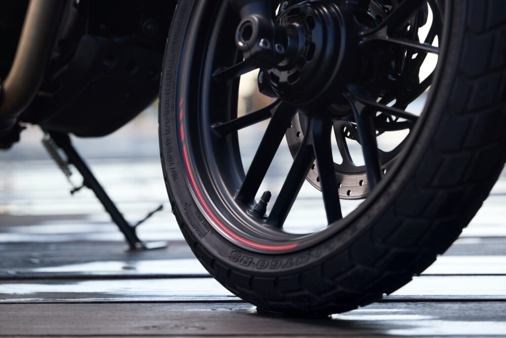 Close-up of the Triumph Tracker 400 cast wheel and tyre