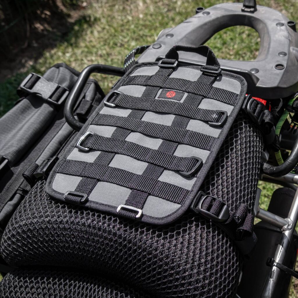 Turkana GeckoGrip tailbag harness strapped across a motorcycle seat