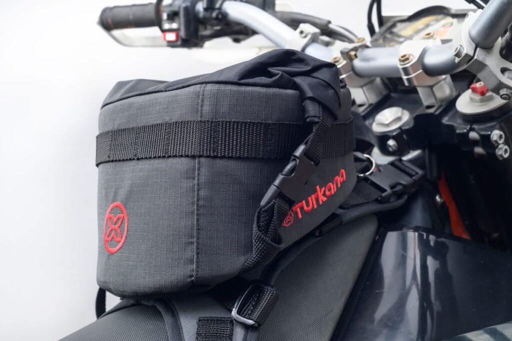 Turkana GeckoGrip tank bag strapped to a motorcycle fuel tank